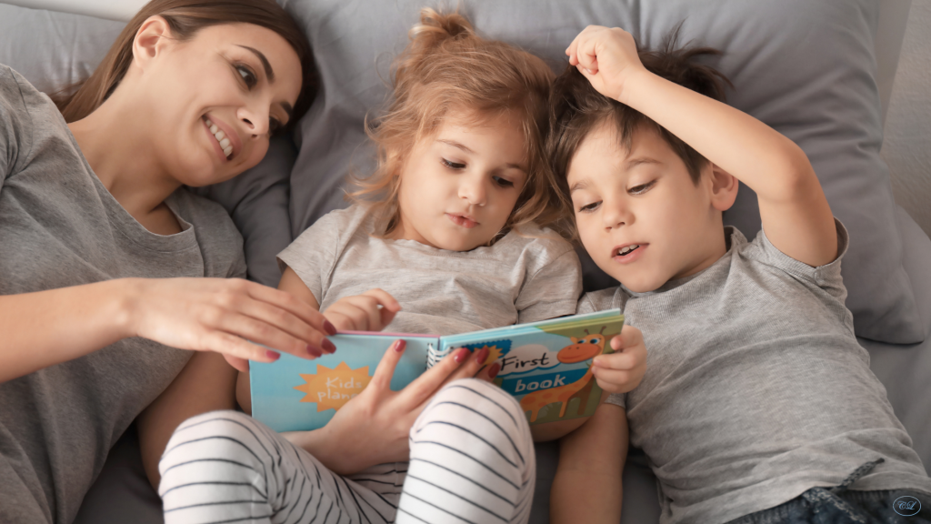 Parent reading a picture book with two children to help kids understand emotions and feelings